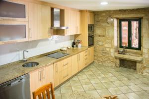 A kitchen or kitchenette at CASA BELAI