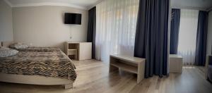 Posteľ alebo postele v izbe v ubytovaní Hotel Intourist
