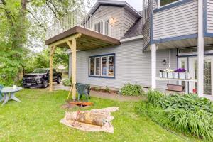 a house with a porch and a deck on top of it at Sheboygan Getaway with Deck and On-Site Lake Access! in Sheboygan
