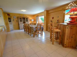 a kitchen and dining room with a table and chairs at Appartement Le Grand-Bornand, 5 pièces, 8 personnes - FR-1-391-41 in Le Grand-Bornand