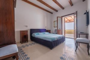 a bedroom with a bed and a mirror at Villa Chiara in Lipari