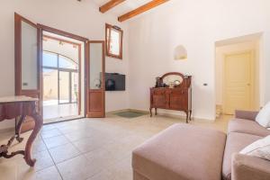 a living room with a couch and a table at Villa Chiara in Lipari