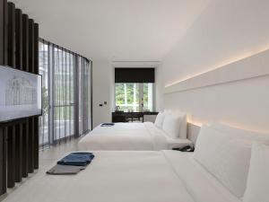Katil atau katil-katil dalam bilik di Orient Luxury Hotel-Jiaoxi