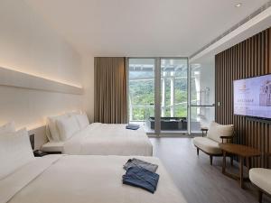 Katil atau katil-katil dalam bilik di Orient Luxury Hotel-Jiaoxi