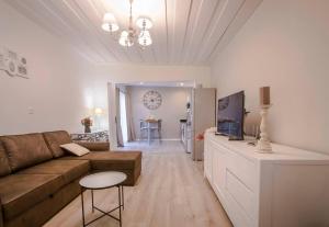 Posezení v ubytování Tiny Badamier Blanc appartement 4 étoiles 2 à 4 personnes piscinelle chauffée