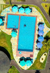 an overhead view of a pool with blue water at Lemon Beach Resort in Elmina