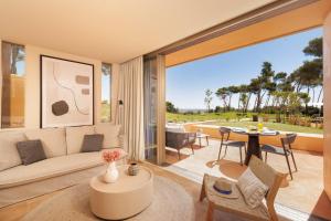 a living room with a couch and a table at Palmares Signature Apartments in Lagos