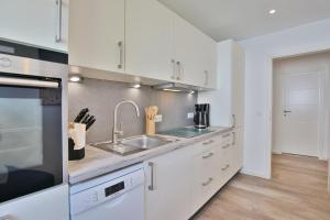 Køkken eller tekøkken på Haus am Seehof 9 Ferienwohnung Ostseeliebe Nr 5