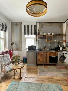 a kitchen with a couch and a table in a room at Heristage Istanbul in Istanbul