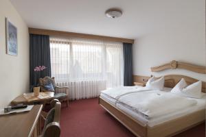 Postel nebo postele na pokoji v ubytování Hotel Gasthof Hereth