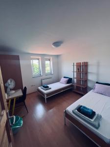 Postel nebo postele na pokoji v ubytování Rooms Busija