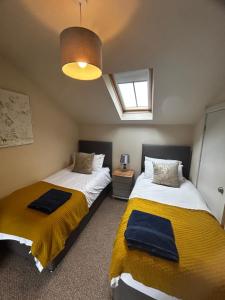 En eller flere senge i et værelse på Tanyard Cottage - Whixley, York, North Yorkshire