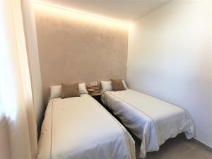 Posteľ alebo postele v izbe v ubytovaní Villas Florida