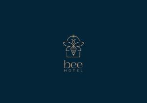 a logo for a bee hotel at Bee Hotel in Vlorë