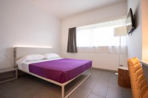 Postel nebo postele na pokoji v ubytování Hotel Stadio & Spa