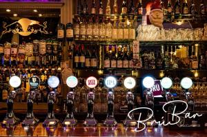 a bar with a bunch of bottles of alcohol at Bru Bar & Hostel in Cork