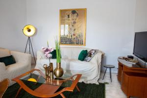 a living room with a table and a couch at Villa Mareonda - Apartments Sussurro in Rovinj