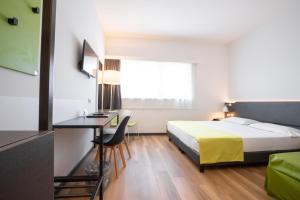 Postel nebo postele na pokoji v ubytování Hotel Stadio & Spa