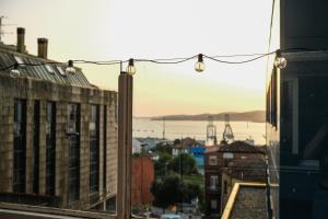 a view of a city from a window at Alojamiento Pichi in Vigo