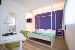 Postel nebo postele na pokoji v ubytování Hotel Stadio & Spa