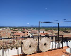 a balcony with a view of a city at Casa Rural La Gineta in Calaceite