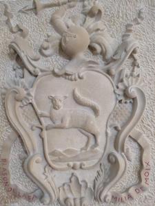 a stone relief of a sheep in a frame at Casa Rural La Gineta in Calaceite