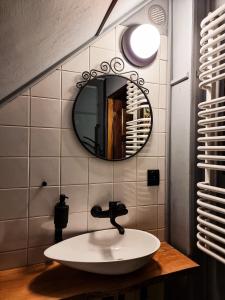 a bathroom with a sink and a mirror at Dobre wCzasy in Stronie Śląskie