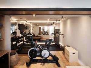 a room with a gym with exercise equipment in it at Hom Santorini in Oia