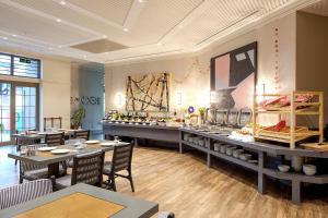 a large room with tables and chairs in a store at Nova Vista Deluxe & Suites a Member of Radisson Individuals in Eskisehir