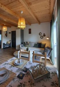 a living room with a couch and a table at Vulcanus Apartment in Badacsonytomaj