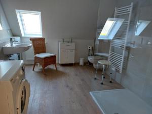 a bathroom with a sink and a toilet and a sink at Klosterblick in Bad Doberan +44 photos
