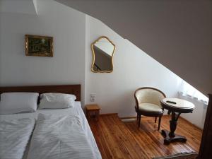 Łóżko lub łóżka w pokoju w obiekcie Willa Magnat