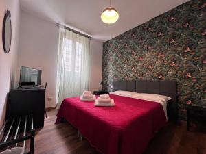 A bed or beds in a room at Hotel Brenta