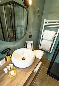 a bathroom with a sink and a mirror at Casa Corsetti - Locanda e Ristorante in Magione