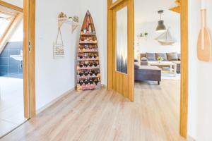 a room with a christmas tree in front of a door at Apartmán Riviéra Lipno 510/21 in Lipno nad Vltavou +67 photos