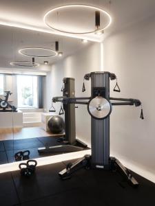 a room with a gym with a treadmill at Hom Santorini in Oia
