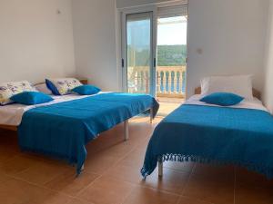 Voodi või voodid majutusasutuse Mare Apartments toas