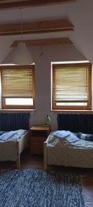 Posteľ alebo postele v izbe v ubytovaní Barackvirág Apartmanház