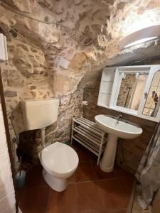 a bathroom with a toilet and a sink at Casa Il Rosone in Carovigno