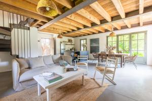 a living room with a couch and a table at La Bergerie in Argelès-sur-Mer