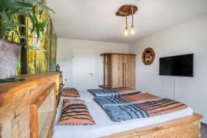 Rúm í herbergi á Im Rodeck Nest