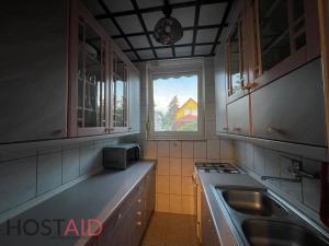 a kitchen with a stove and a window in it at STÉG64 - Ráckeve - hostAID in Ráckeve +42 photos