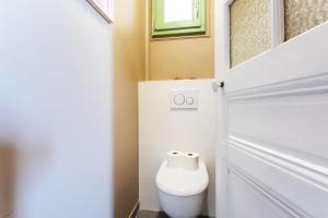 een badkamer met een toilet en een deur bij Villa Reve d azur vi4353 by Riviera Holiday Homes in Nice