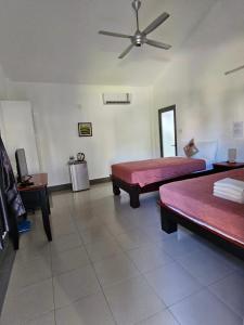 A bed or beds in a room at Catsen Bungalows & Pool Phan Thiet