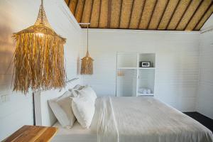 Postel nebo postele na pokoji v ubytování Stardust Villas + 37 fotografií