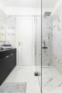 a bathroom with a shower with a glass door at Apartment Magdalena in Malinska +44 photos