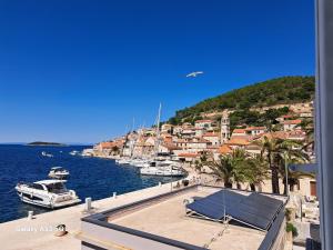 a view of a harbor with boats in the water at Heritage Rooms Kut in Vis