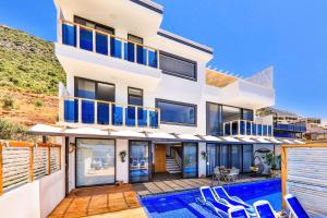 a villa with a swimming pool and a house at Villa Jilda Kalkan in Kalkan