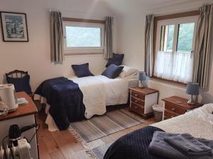 a bedroom with two beds and a window at Soupiets in Betpouey