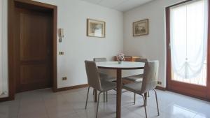 a dining room with a table and chairs at Italianway - Via Pighini 75 in San Fedele Intelvi